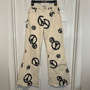 Almost Famous Cream Pants with Black Peace Signs. Size 5. NWOT